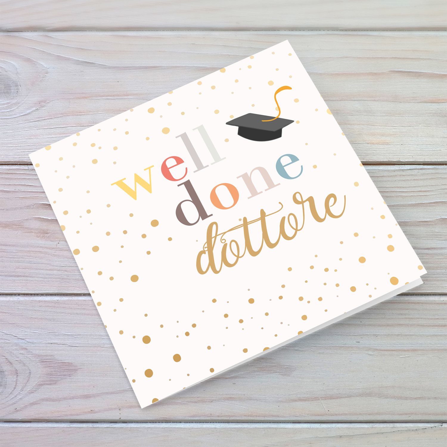Well Done card - dottore with colourful text, graduation hat and scattered spots in English