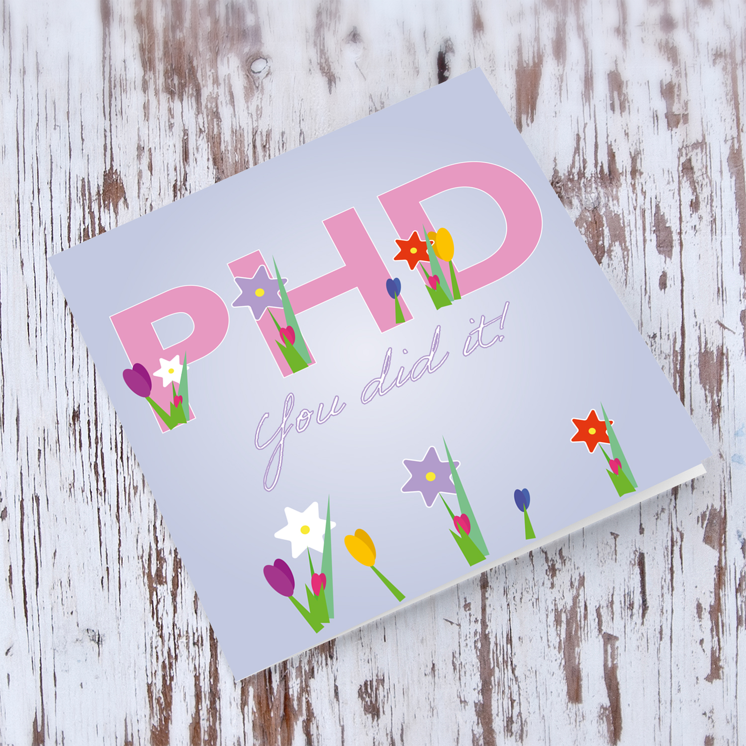 PHD - Graduation card in English (flowers coming out of text and lilac background)