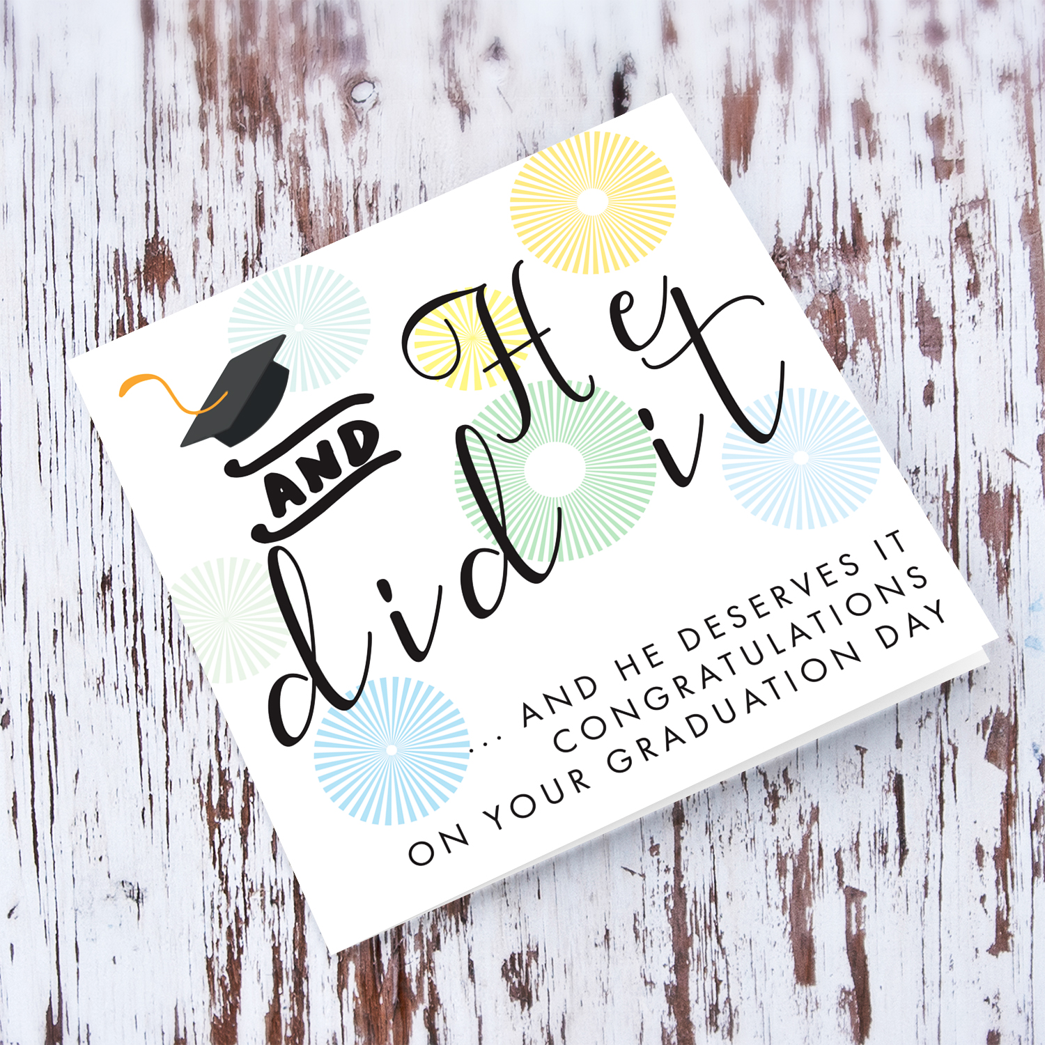 You he did it and he deserve it - Graduation card with blue and green designs and graduation hat in English