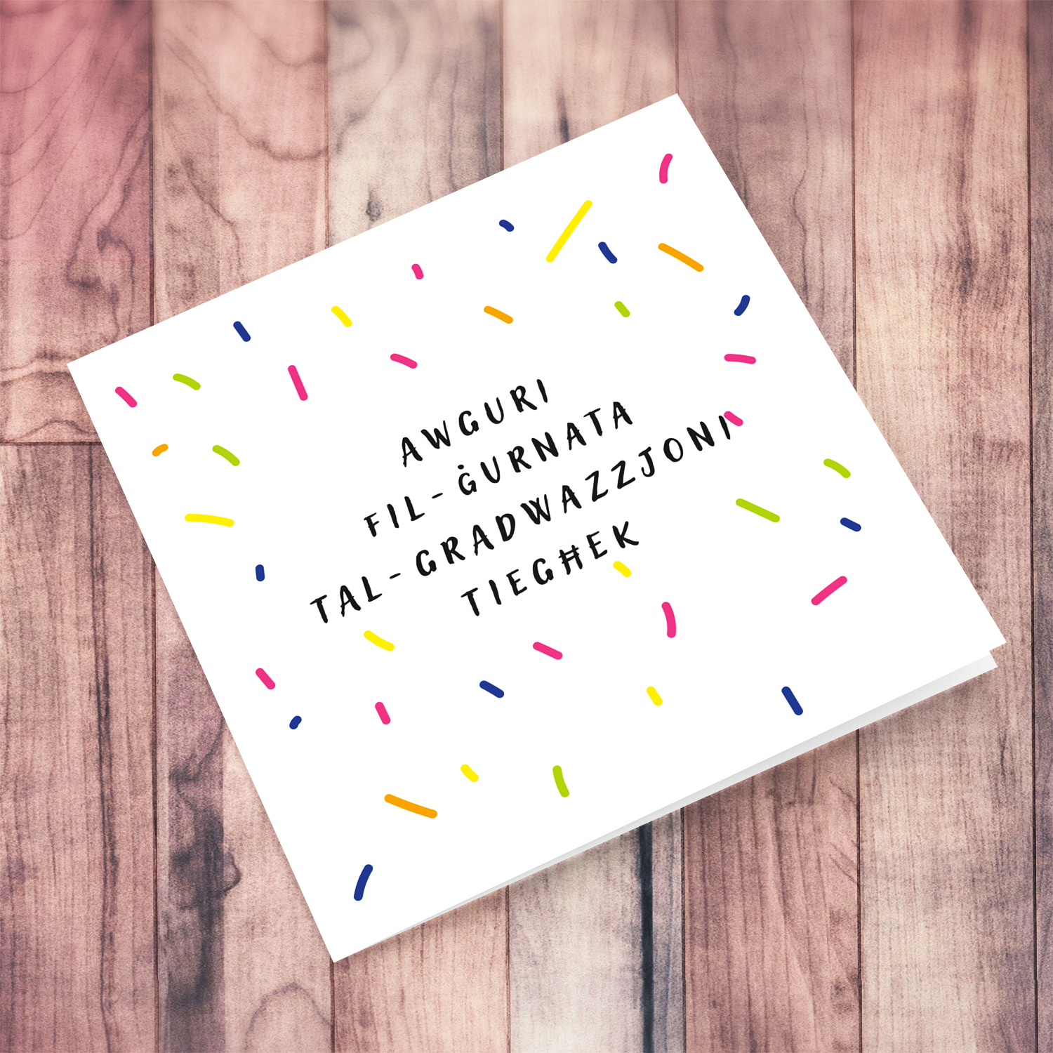 Colourful graduation card in Maltese with scattered confetti