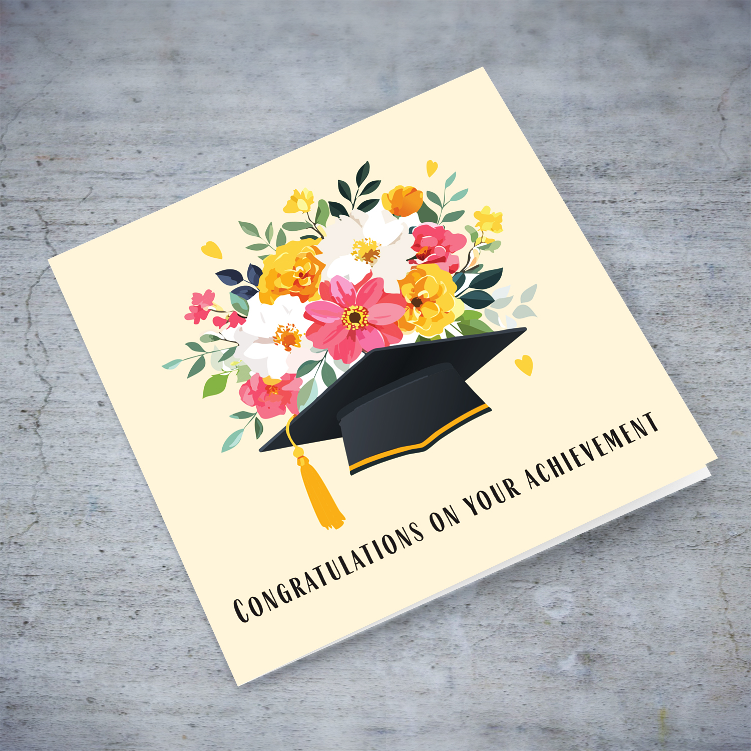 Flower themed graduation card with hat and flowers in a cream background in English