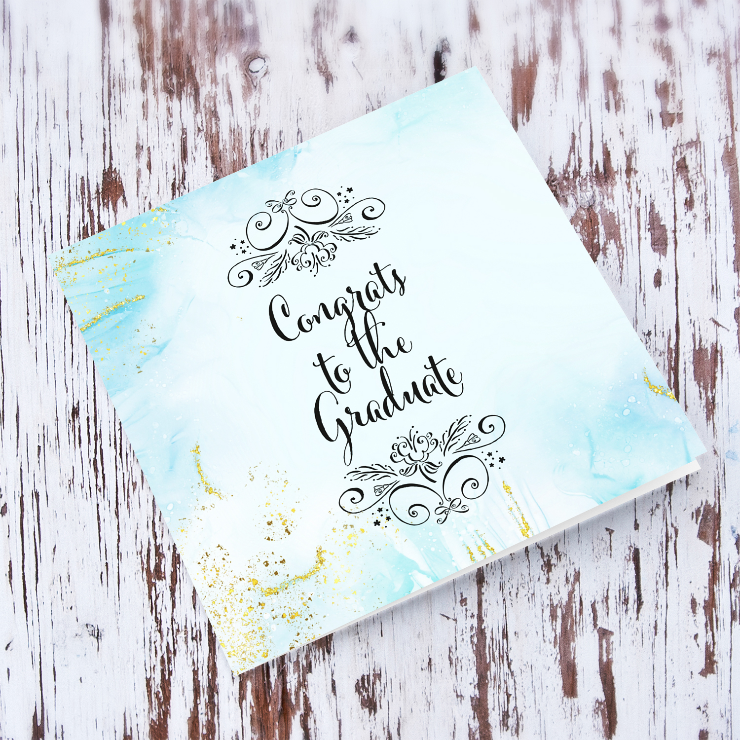 Light blue background with gold tones graduation card in English