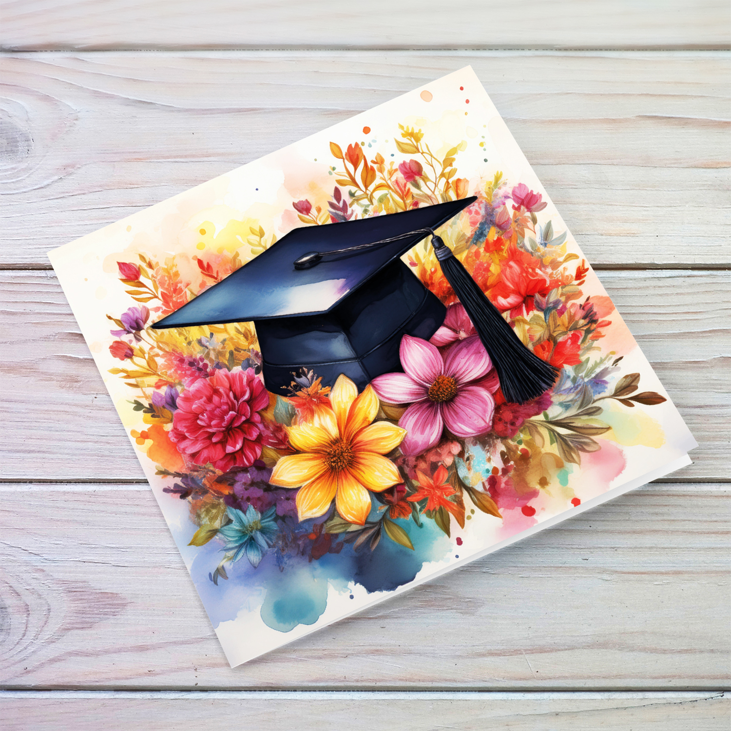 A beautiful watercolour graduation greeting card with a graduation hat on a bouquet of colourful flowers in English