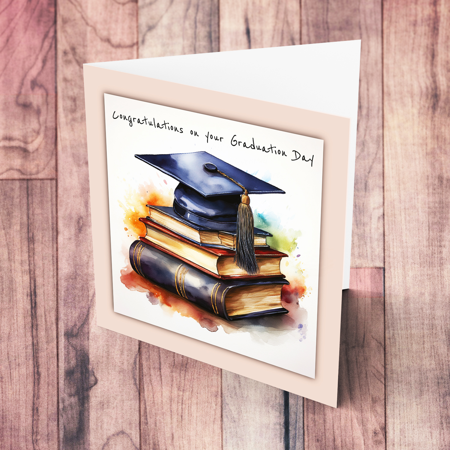 A graduation card featuring a graduation hat sitting on a stack of books, in pink blue border in English