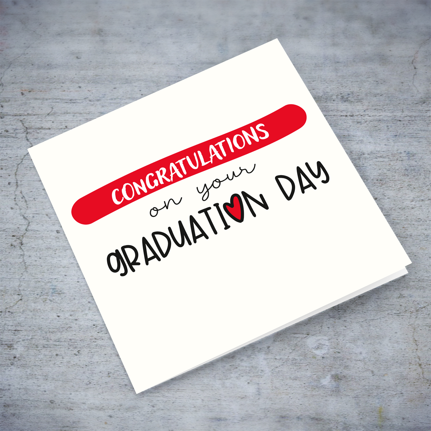A neutral Graduation card in a light cream background and red touches in English