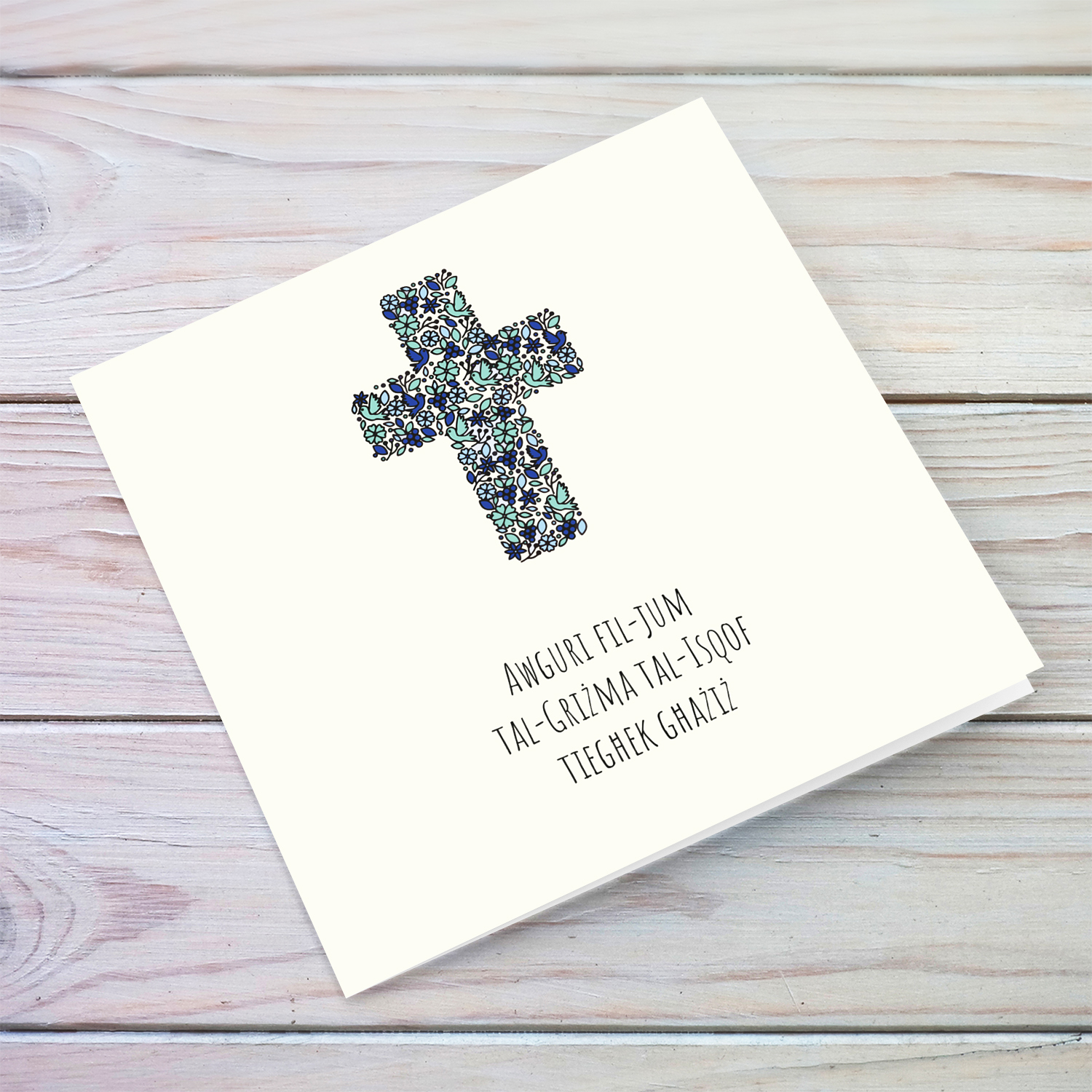 Modern Confirmation card with floral cross (with touches of blue and green) in a light shaded background in Maltese