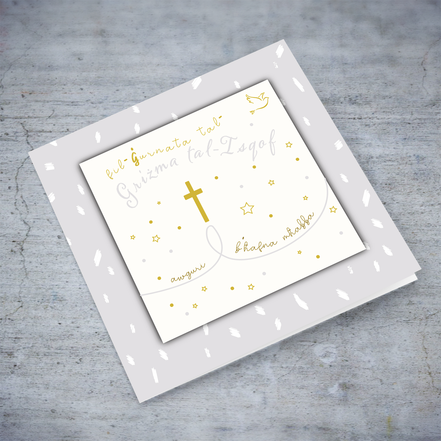 A confirmation card, with white spotted light grey background, with gold & grey text with Cross & Holy spirit in Maltese (Unisex)