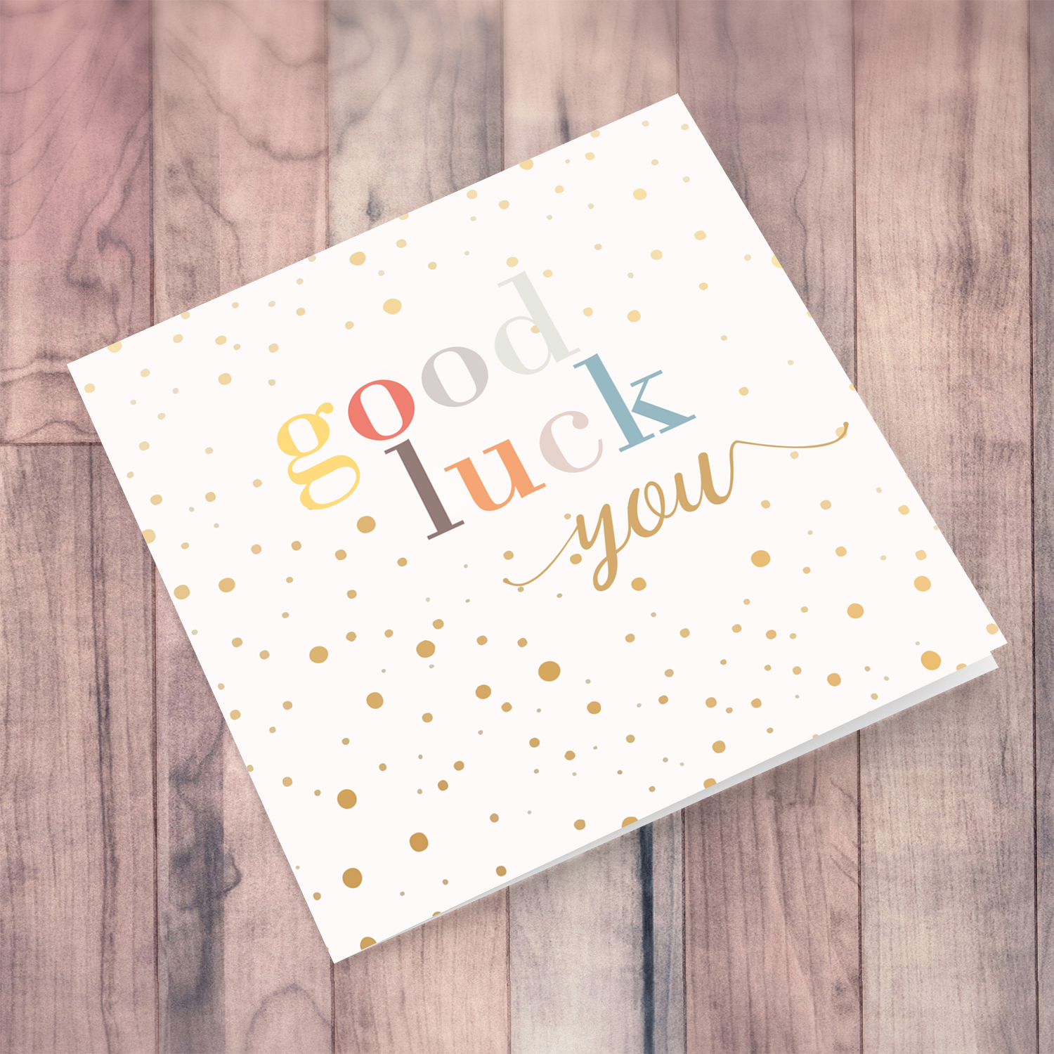 Good luck you greeting card with scattered dots and colourful text in English