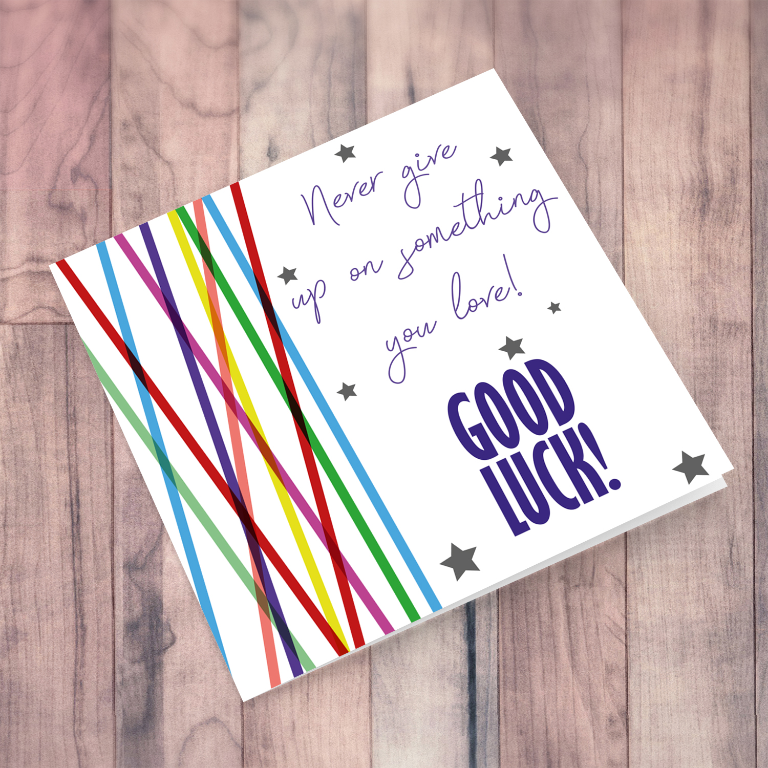 Colourful lines and scattered hearts - never give up good luck card in English