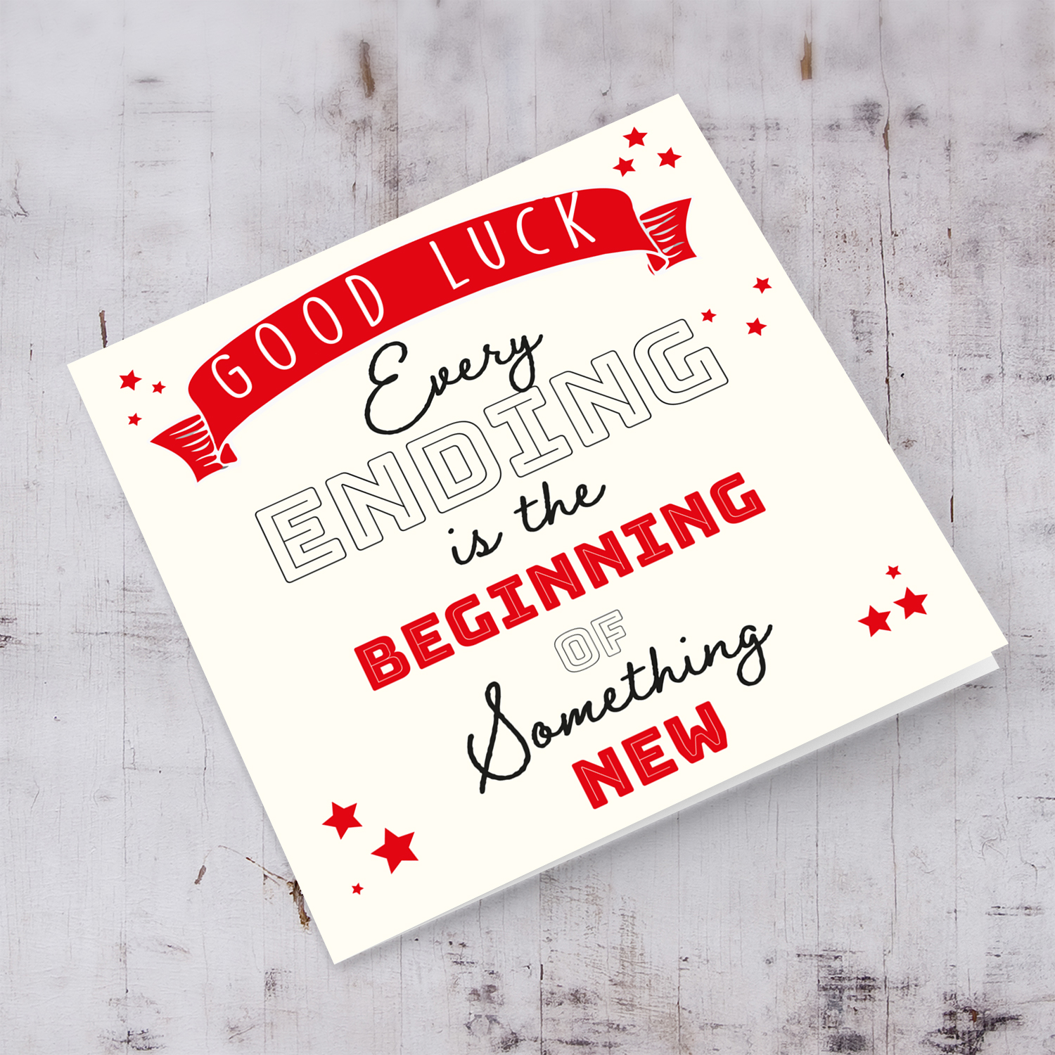 Good luck card with red banner and scattered hearst in English