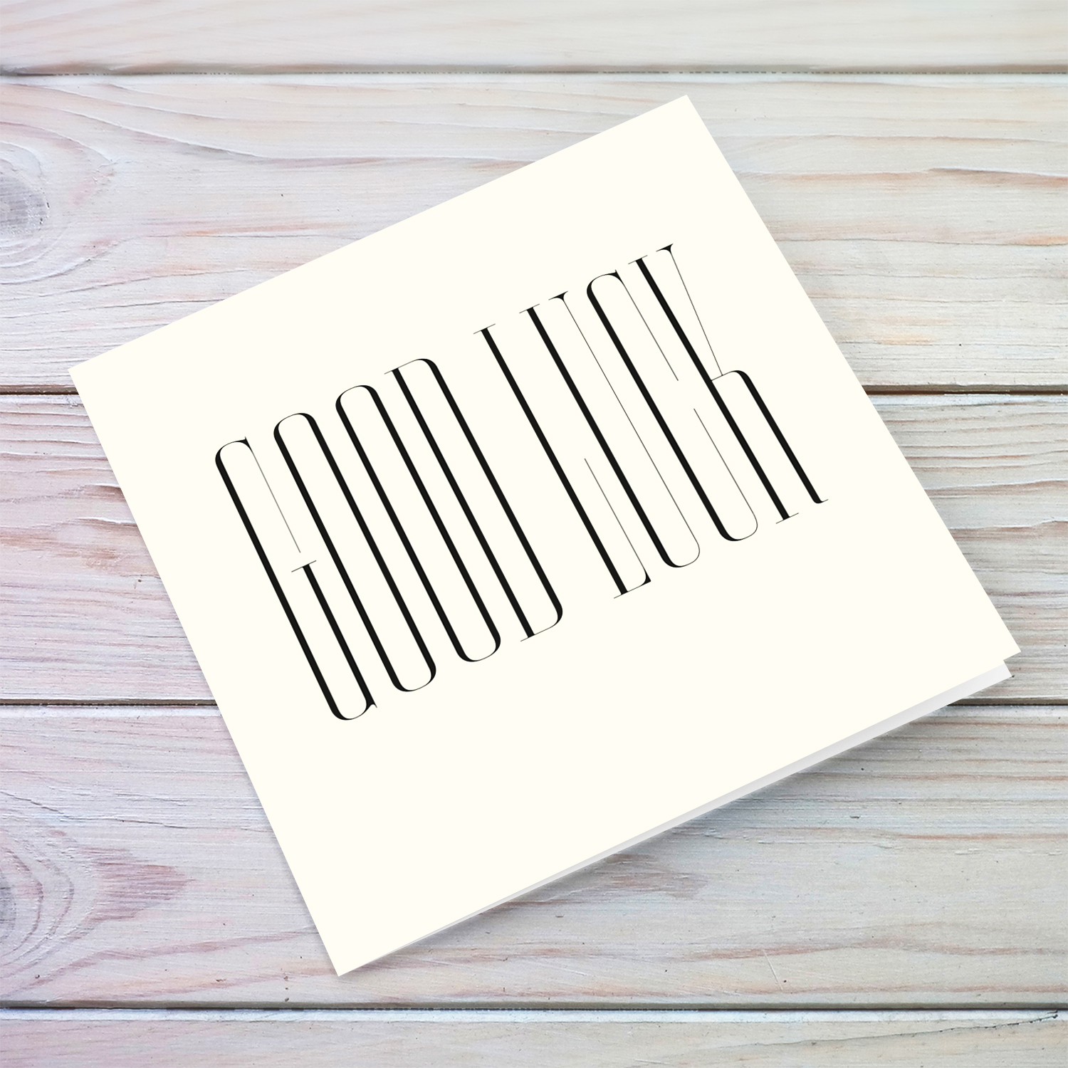 Minimalist text "good luck" card in black text and cream background in English (blank message)
