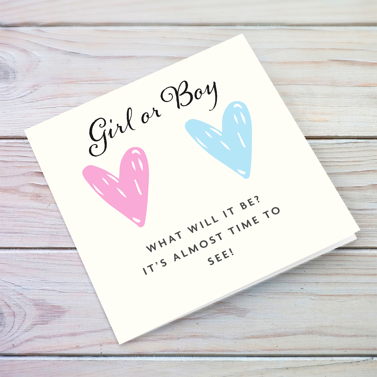 Two hearts gender reveal card girl or boy? in English