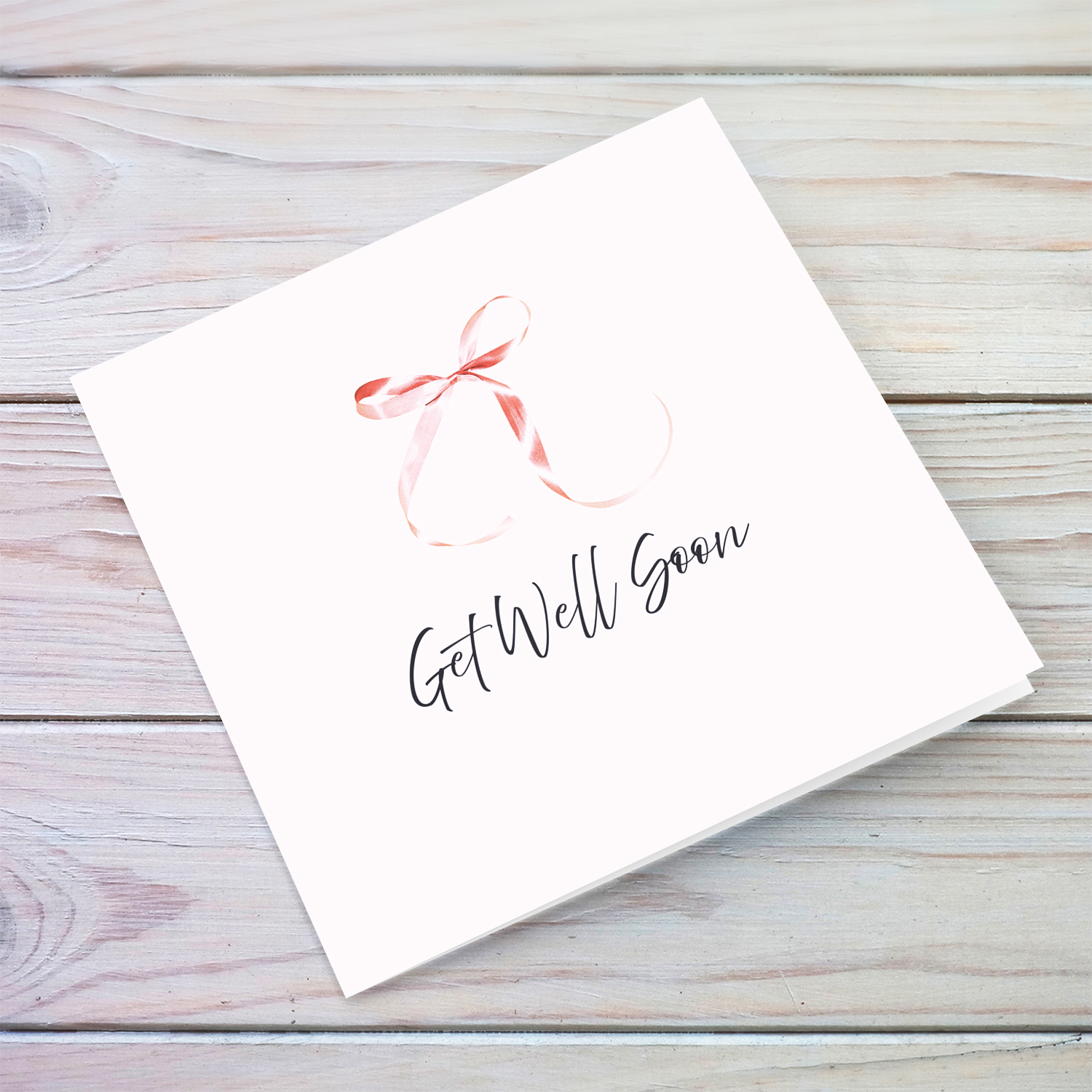 Minimalist and dainty get well soon card with cute pink bow and light pink background in English