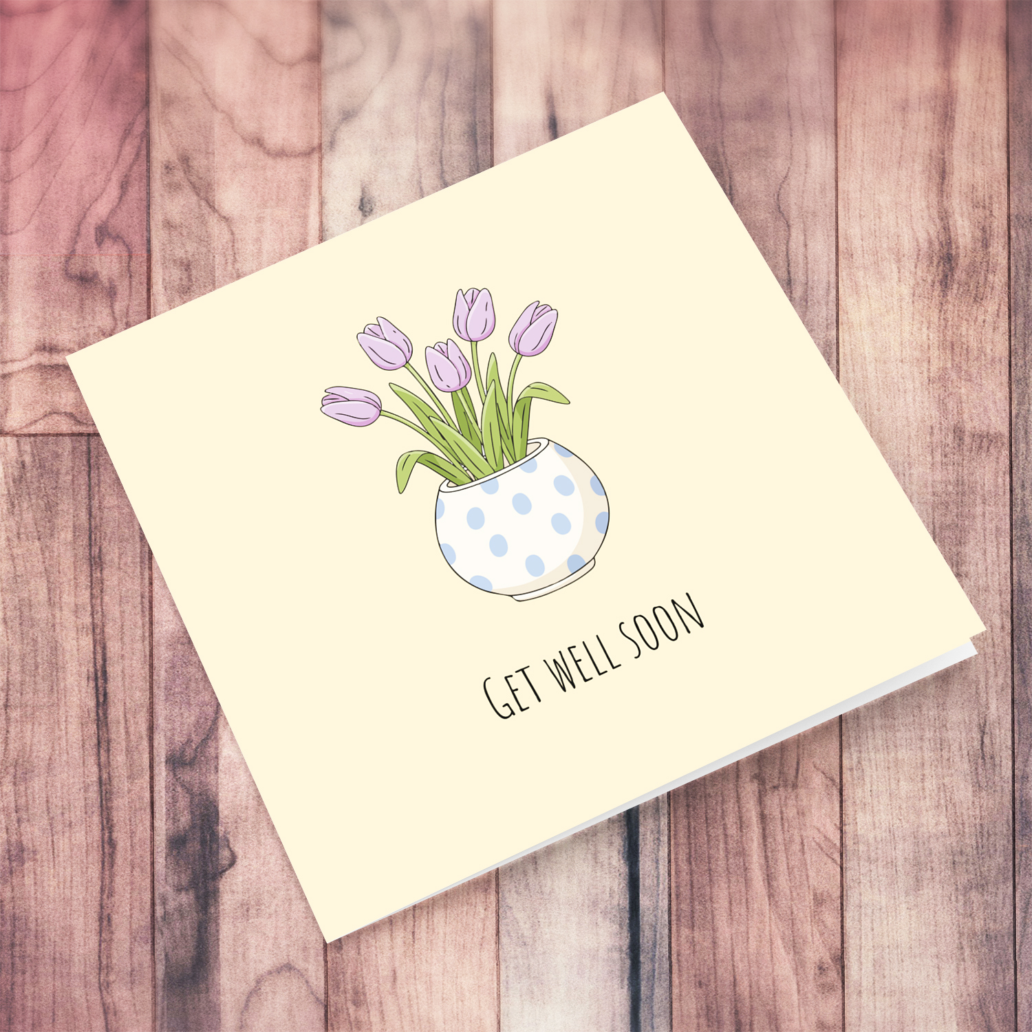 A beautiful get well soon card featuring light purple tulips in spotted vase and neutral background in English