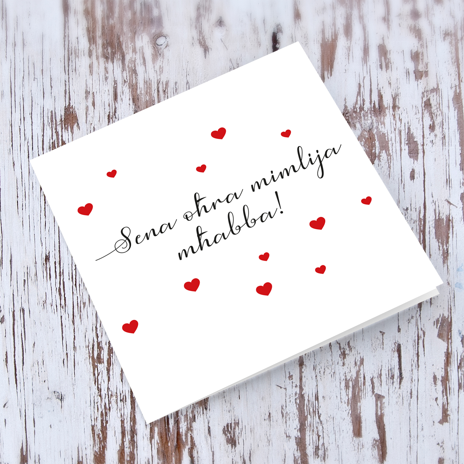 Minimalist anniversary card with scattered red hearts