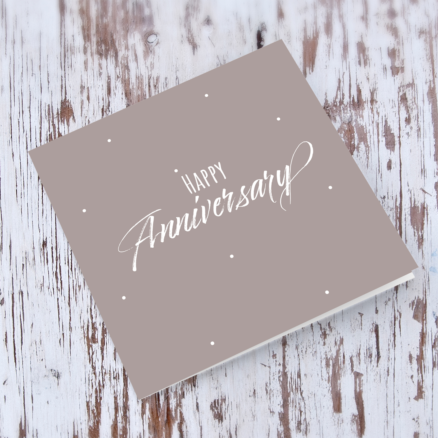 A minimalist Anniversary card in taupe background in English