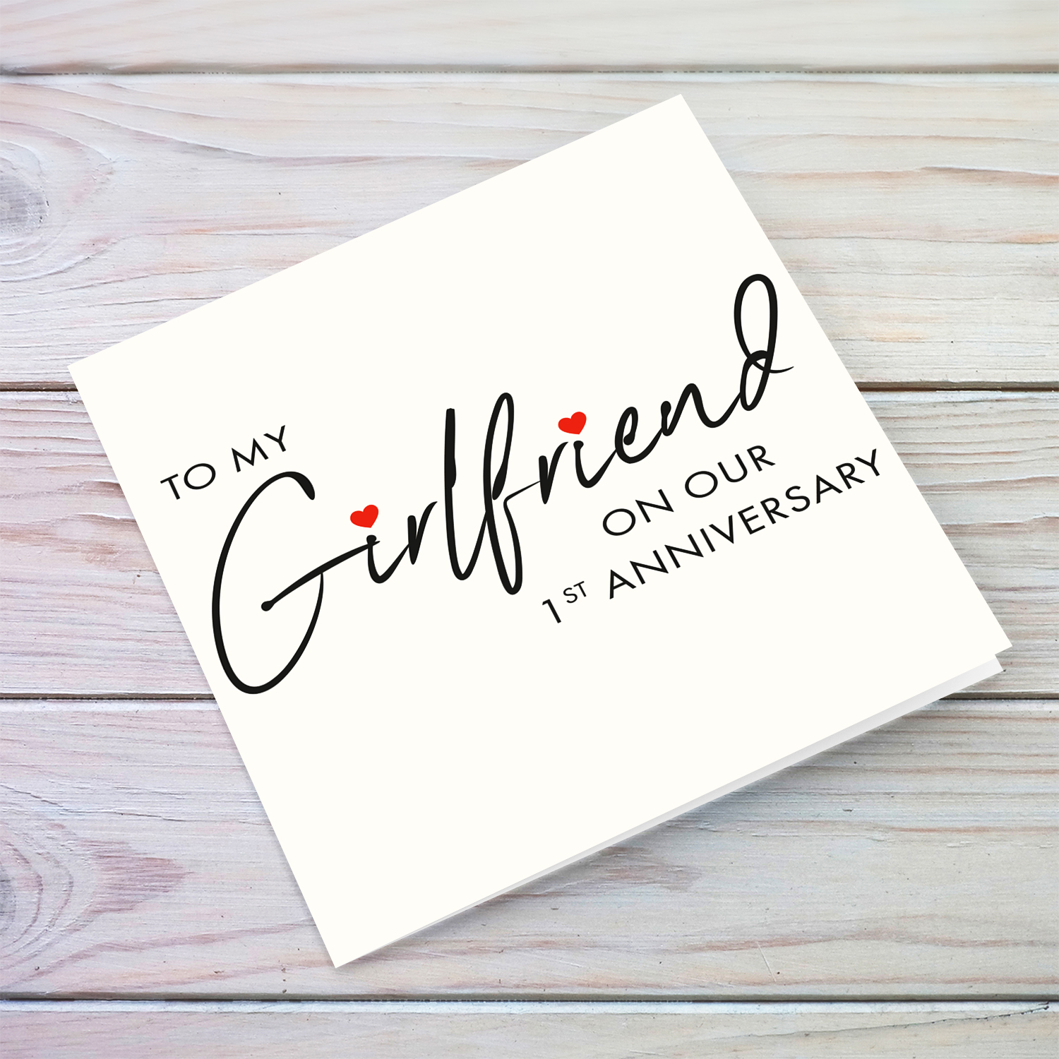 First Anniversary - Minimalist greeting card for girlfriend with red hearts in English