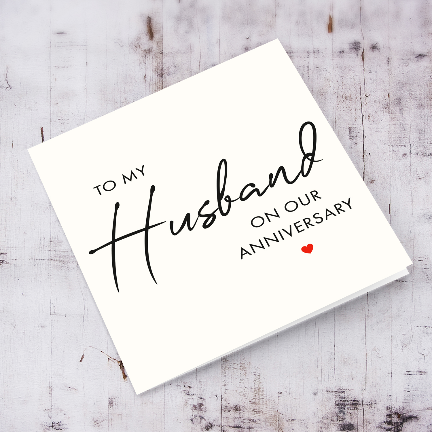 Minimalist anniversary card for husband with red hearts in English