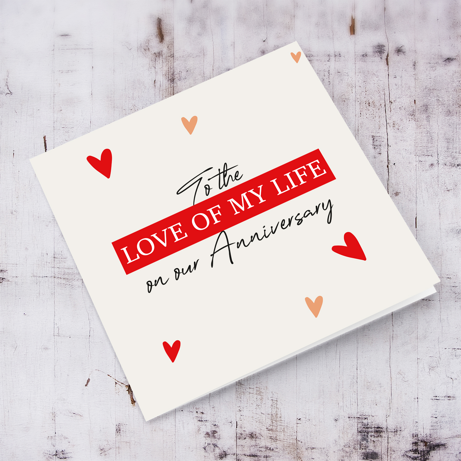 To the love of my life anniversary card with scattered red hearts in English