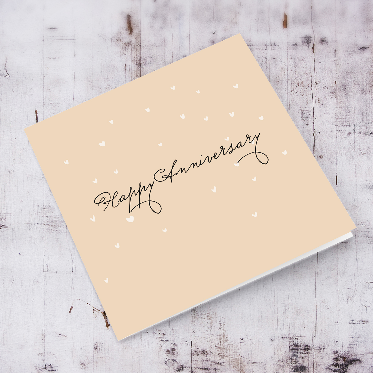 Happy Anniversary neutral card with scattered hearts in English