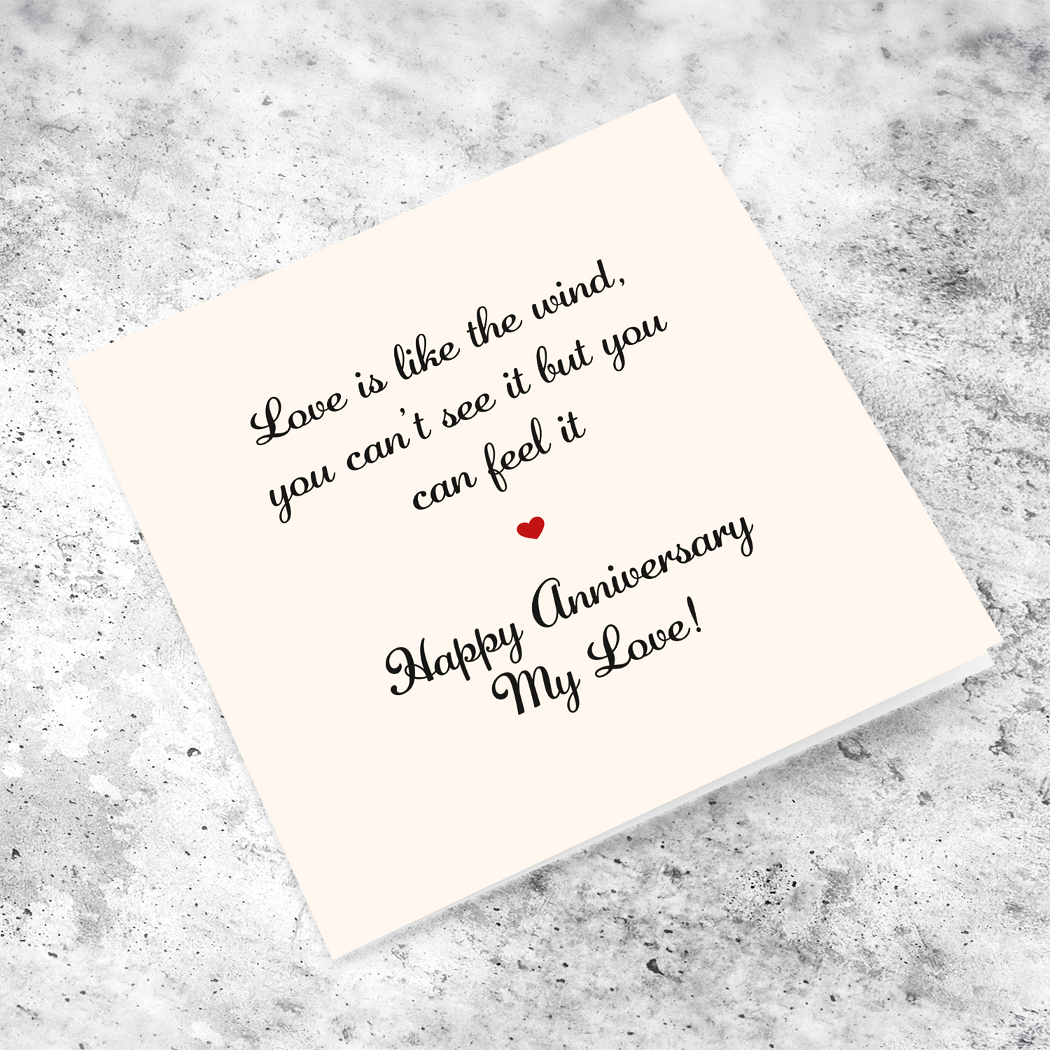 Minimalist romantic anniversary card for the one you love, in a light cream background, black text and red heart in English