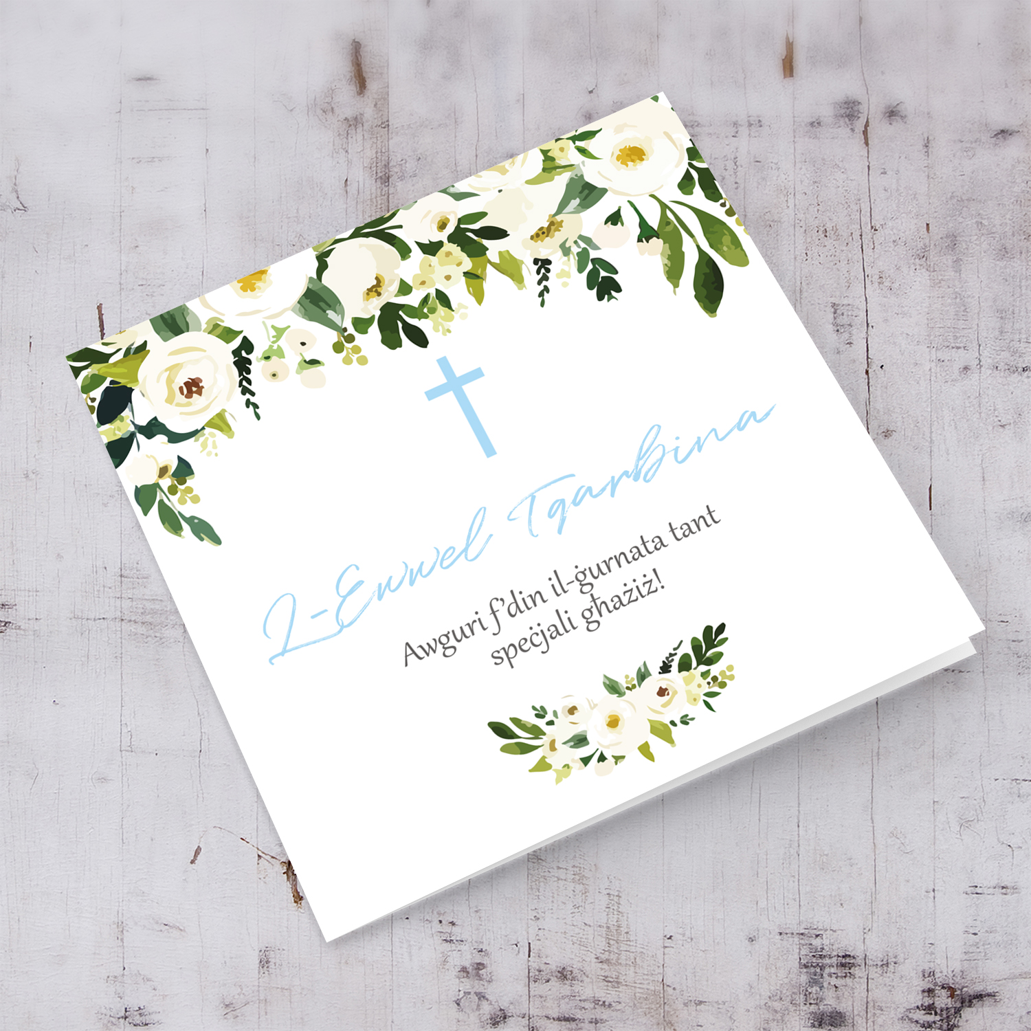 White flower themed Holy Communion card in Maltese for boys with blue cross