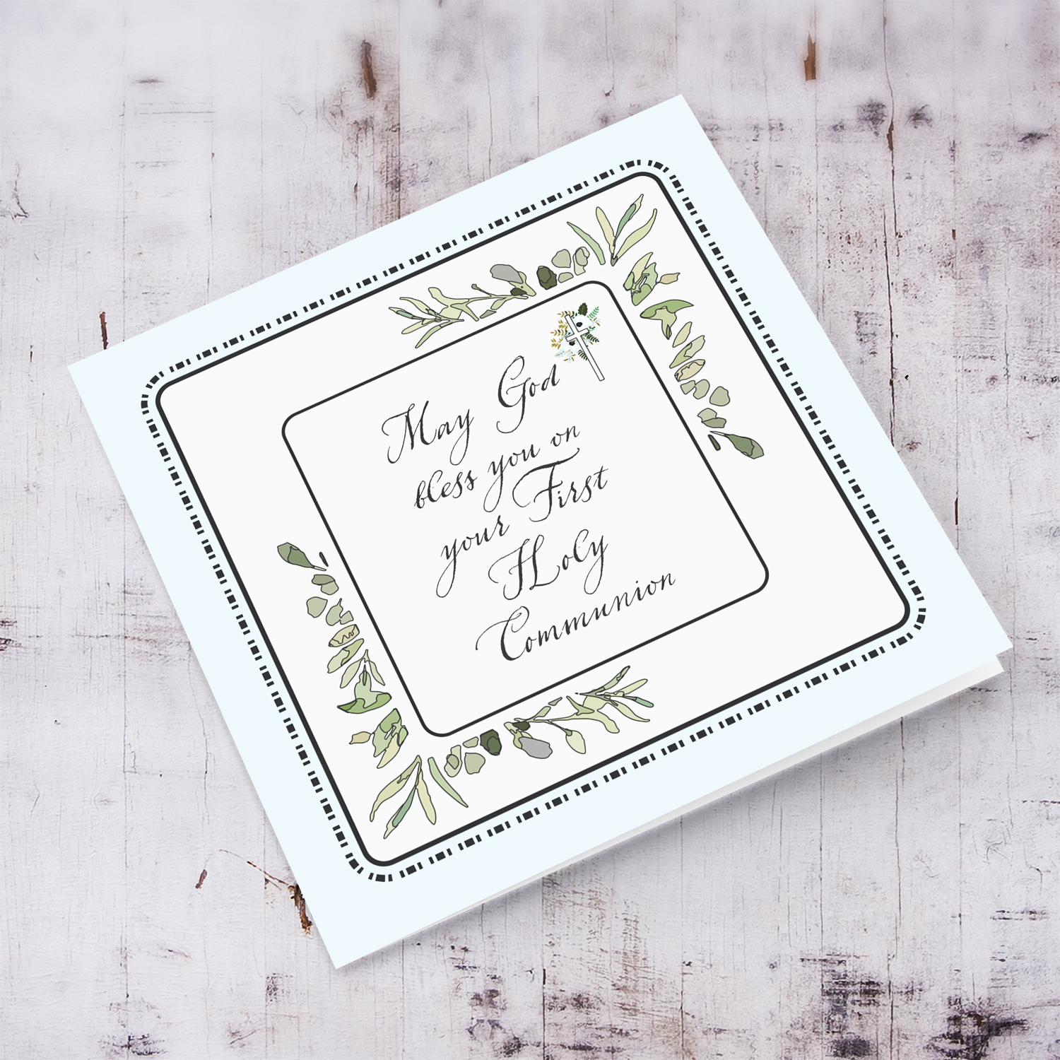 Light blue background, dotted frame and leaves themed Holy Communion Card in English