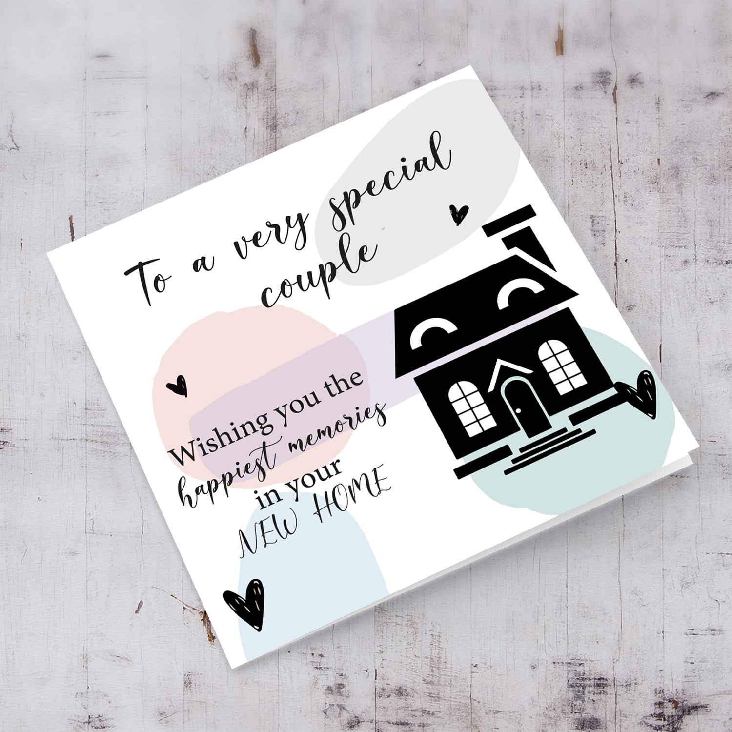 Pastel coloured background new home card in English