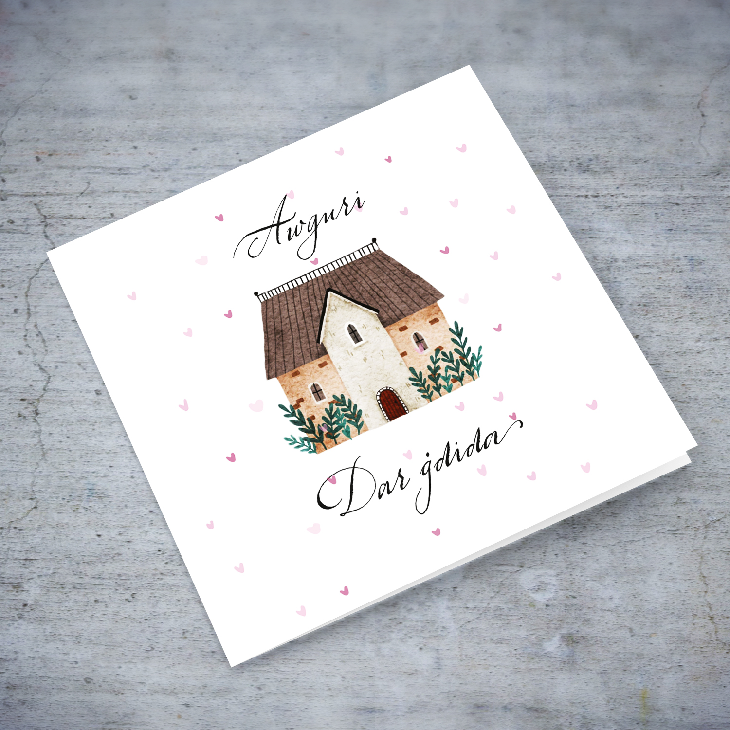 New home greeting card with scattered pink hearts and home illustration in Maltese