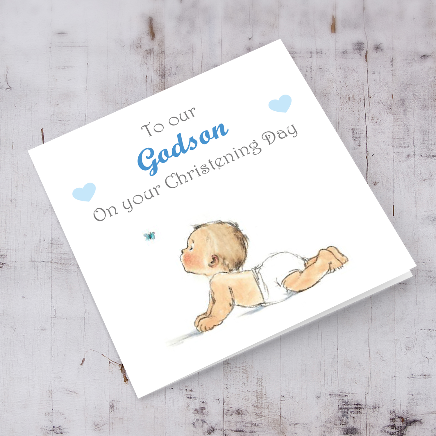Baby with small butterfly baptism card for Godson in English