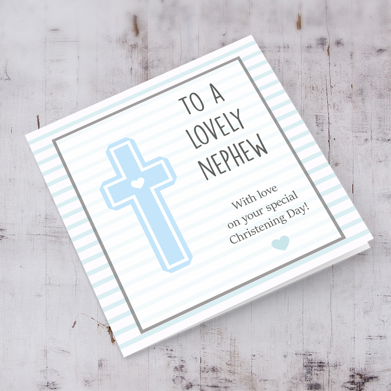 Baptism card with light blue cross with striped background for nephew in English