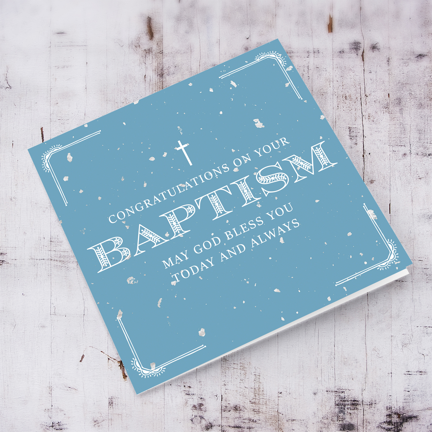 Baptism card for boy in blue speckled background and white text in English