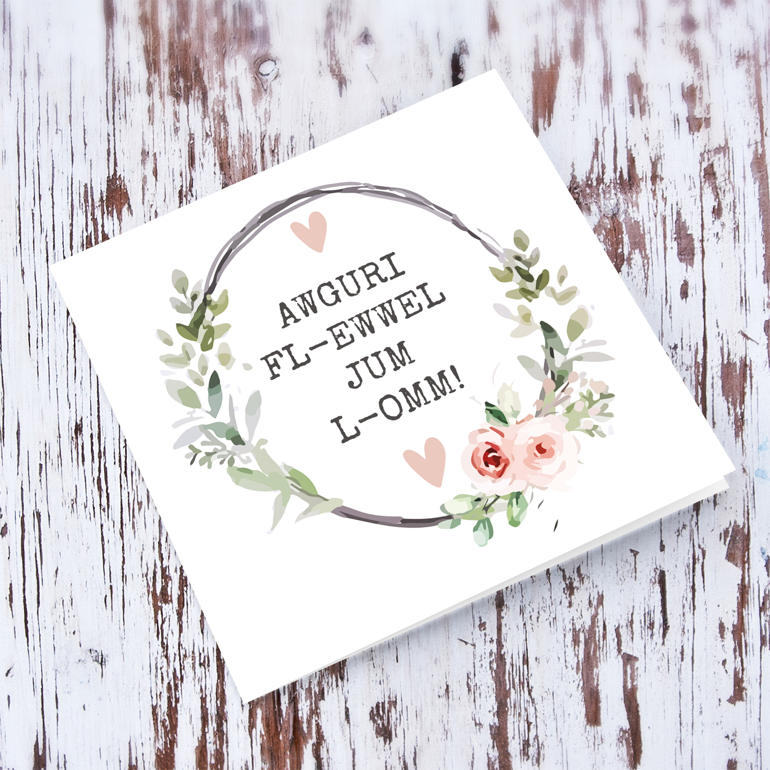 First Mother's day greeting card in Maltese with wreath and pink hearts 