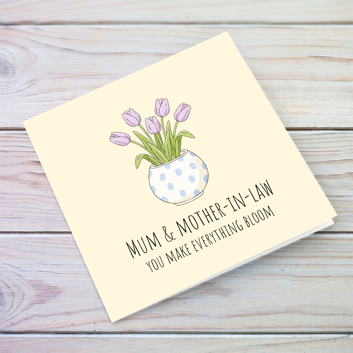 A beautiful mother's day card for mother and mother-in-law featuring light purple tulips in spotted vase and neutral background in English