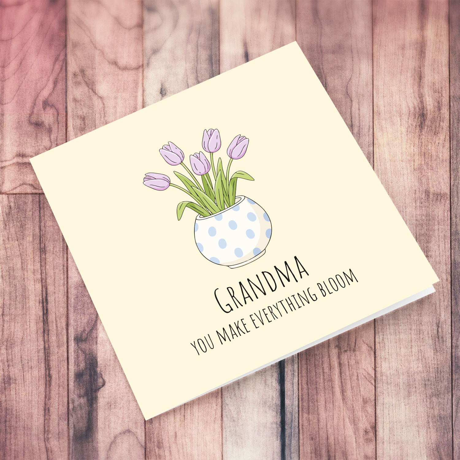 A beautiful mother's day card for grandma featuring light purple tulips in spotted vase and neutral background in English
