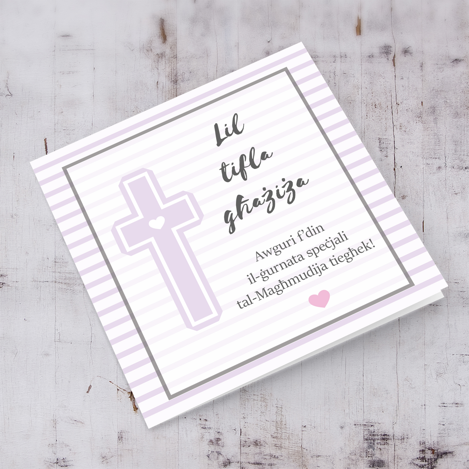 Pink striped background with a cross baptism card for a girl in Maltese
