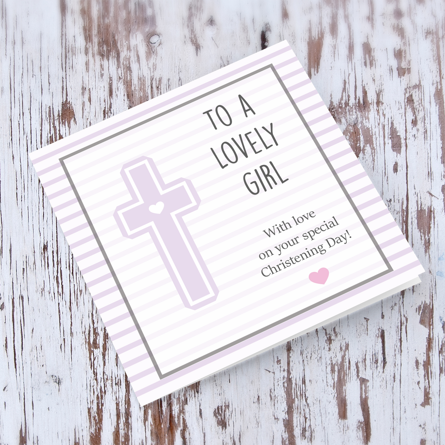 Pink striped background with a cross baptism card for a lovely girl in English