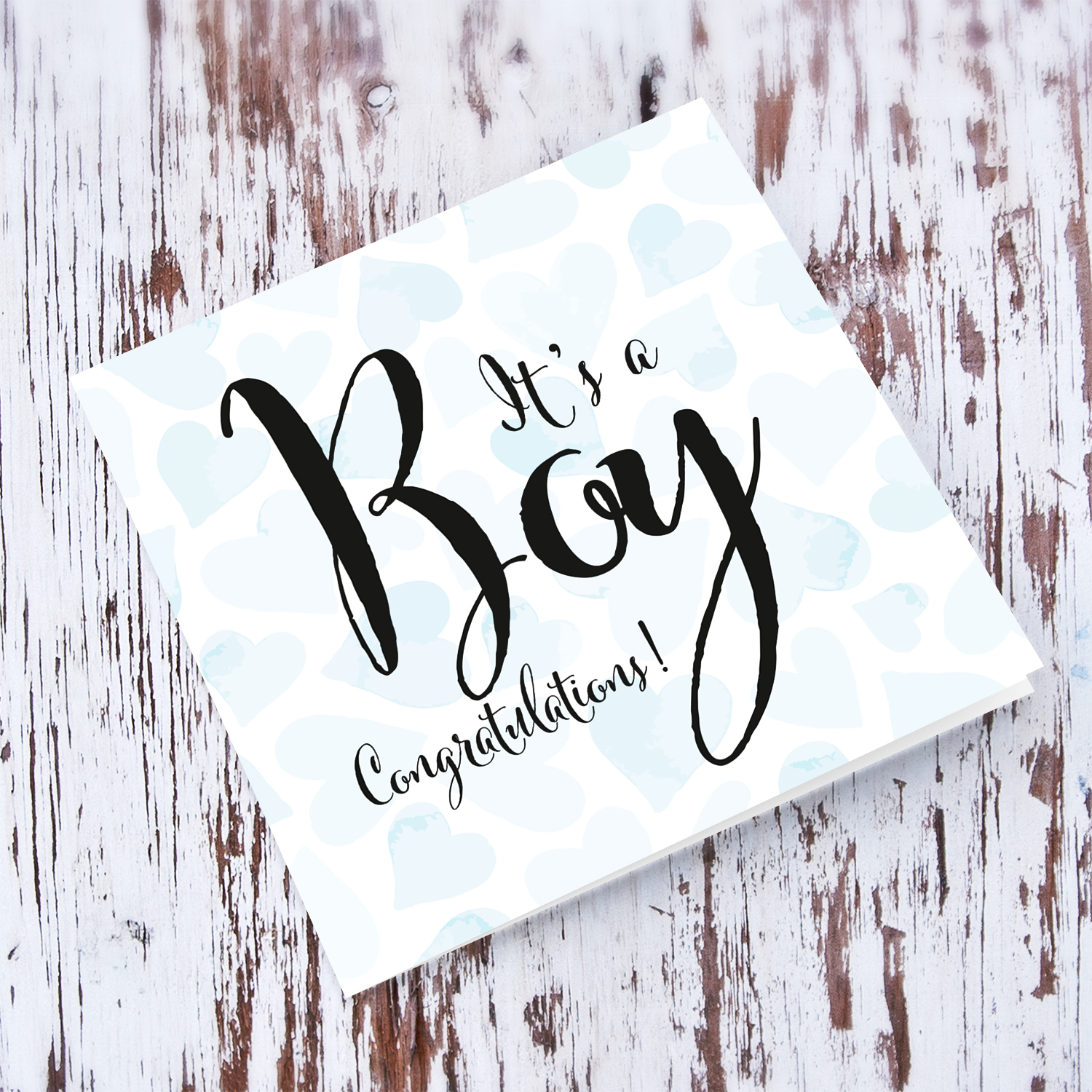 It's a Boy new born greeting card in light blue hearts background in English