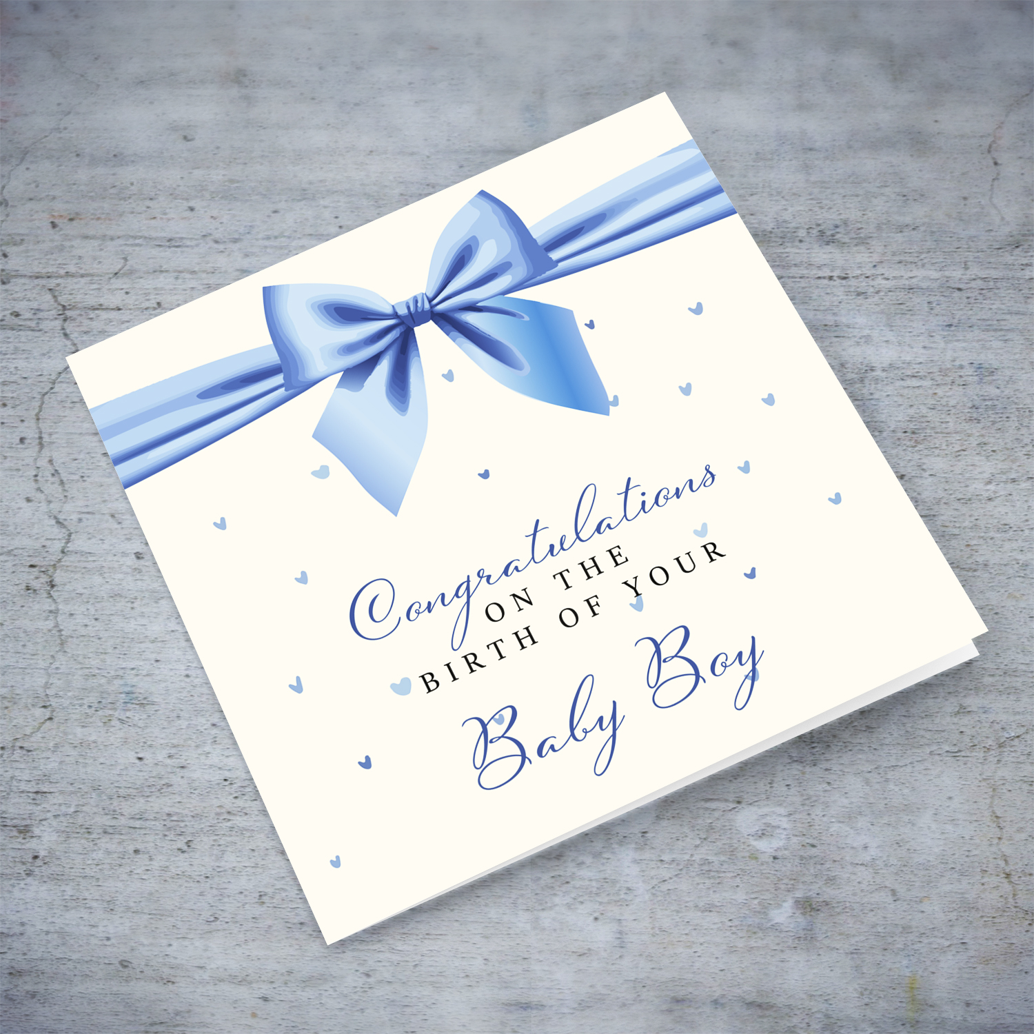 A cute new born card for boys featuring a blue bow in English