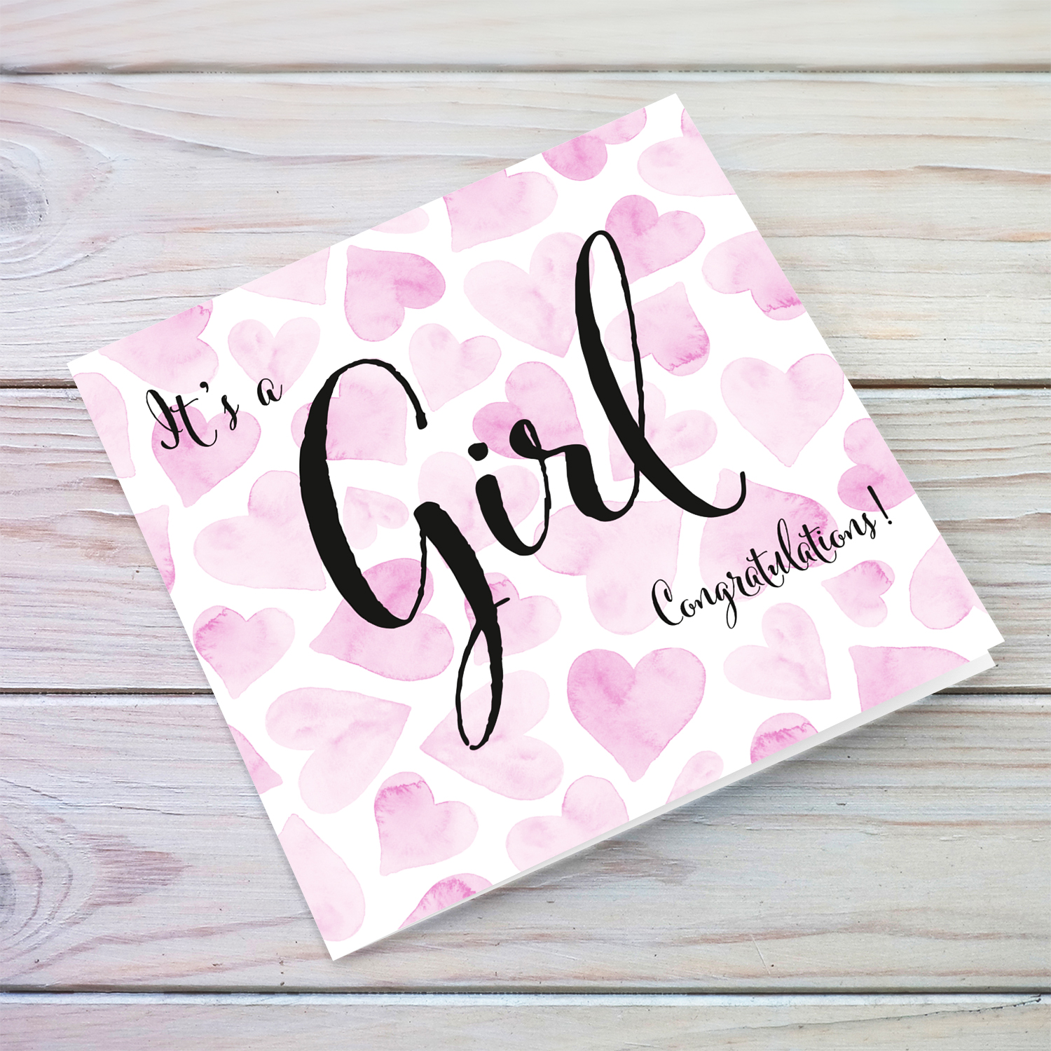 It's a Girl new born greeting card in pink hearts background in English