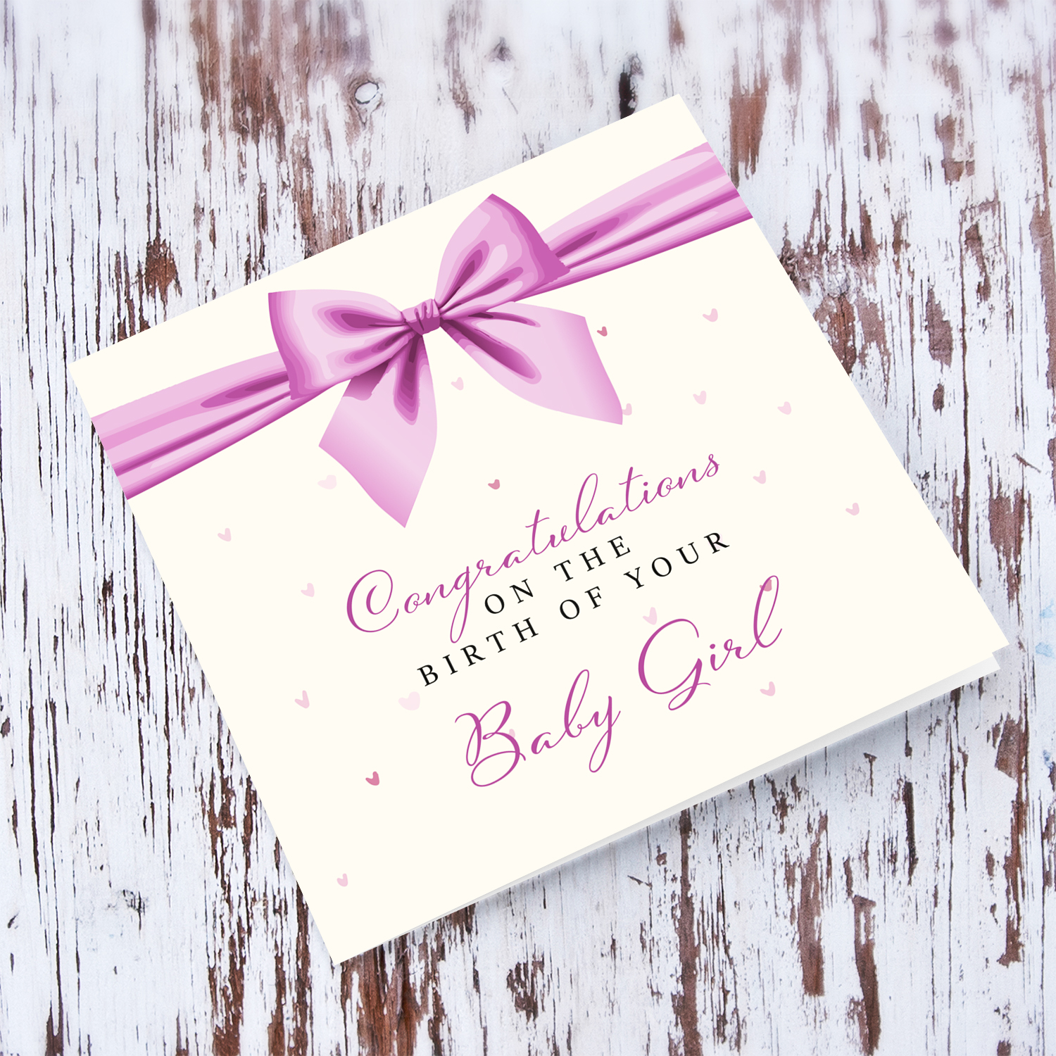 A cute new born card for girls featuring a pink bow in English