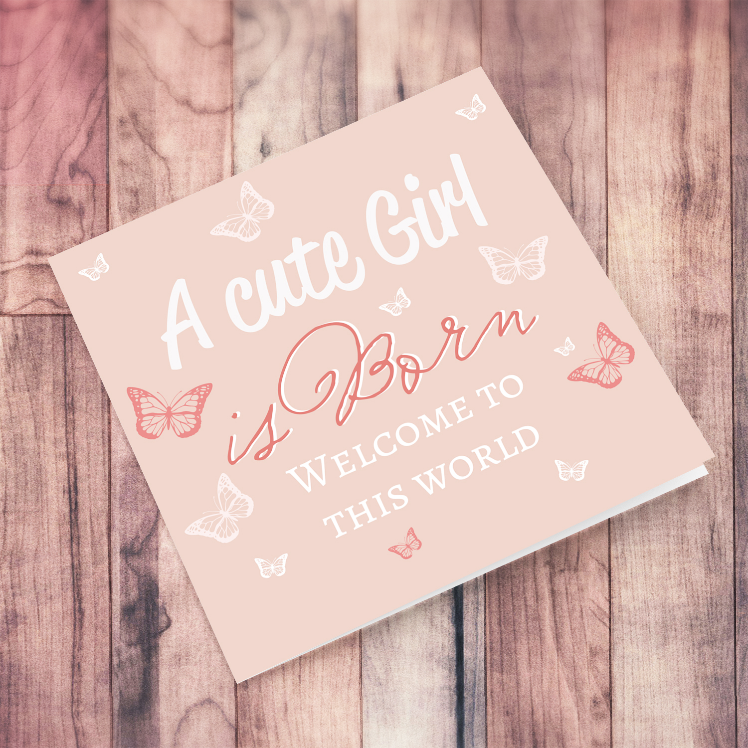 A cute baby girl is born - New born card for girls in light pink background and scattered butterflies in English