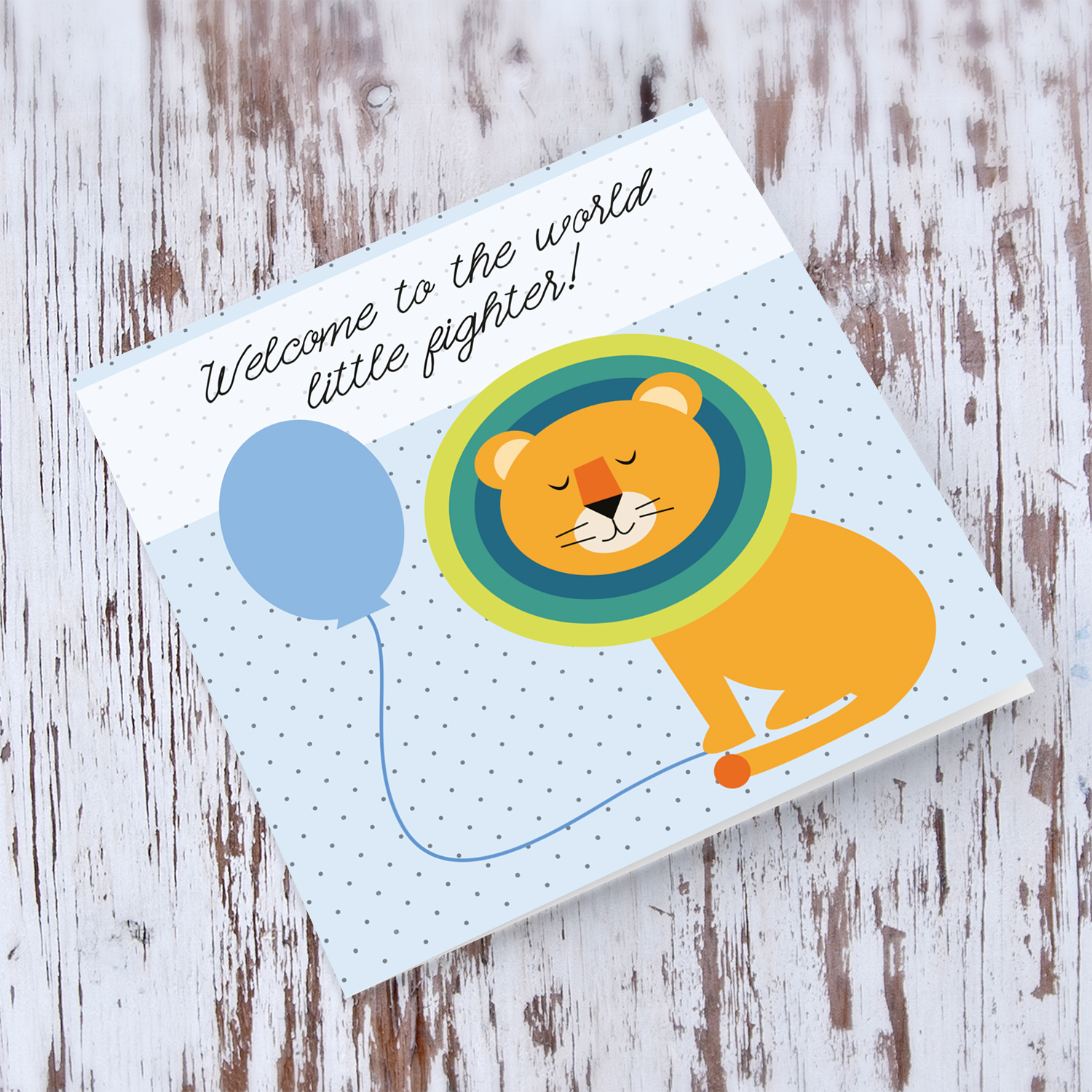 Lion holding blue balloon new born card in English