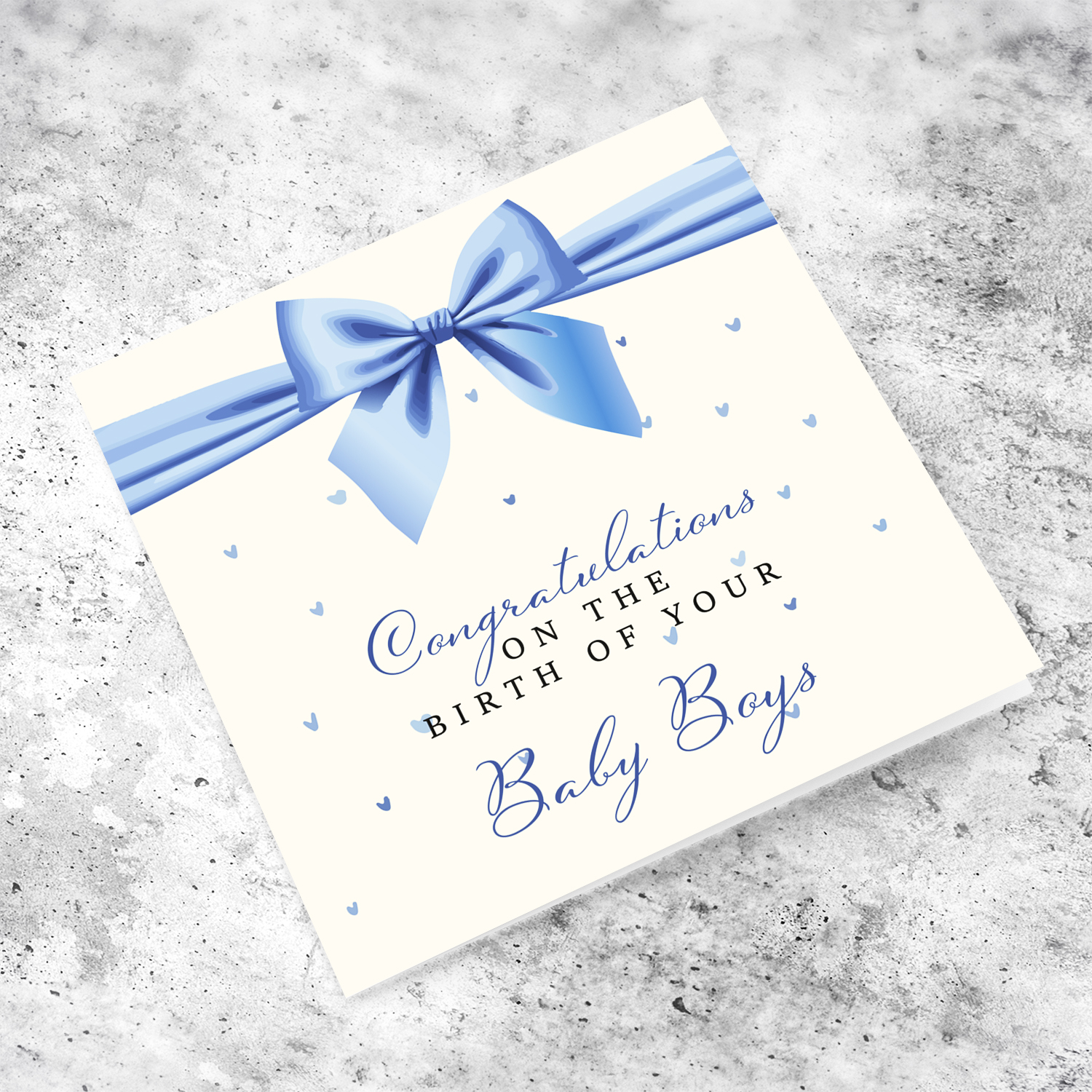 A cute new born card for twin boys featuring a blue bow in English