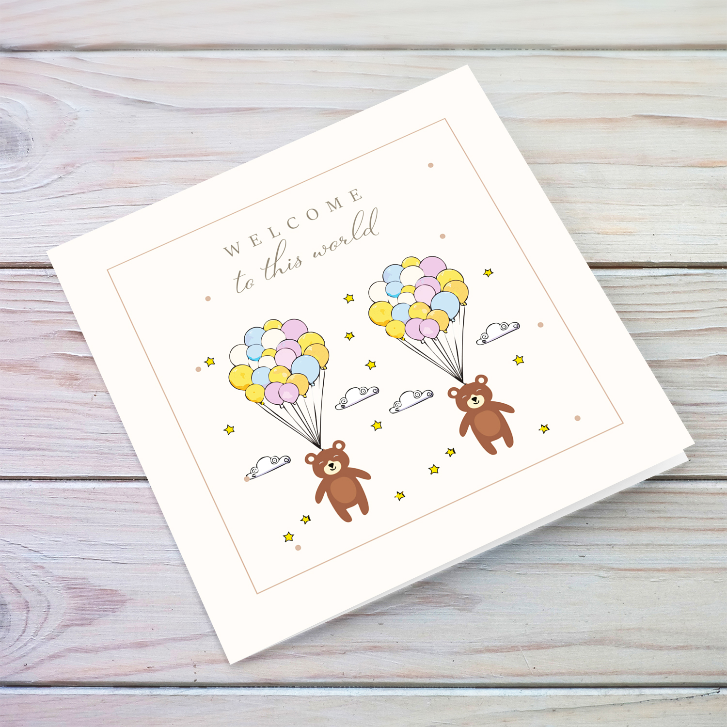 A neutral new born card for twins featuring 2 cute bears with colourful balloons stars and clouds in English