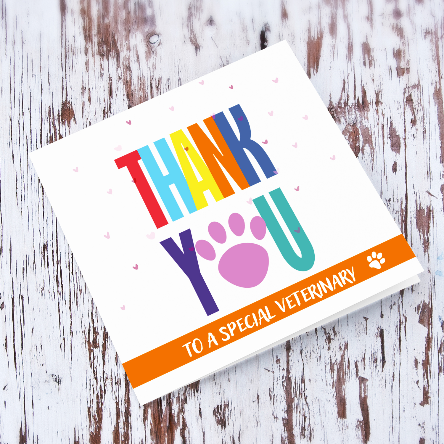Colourful thank you card for Veterinary with paw print and scattered hearts in English