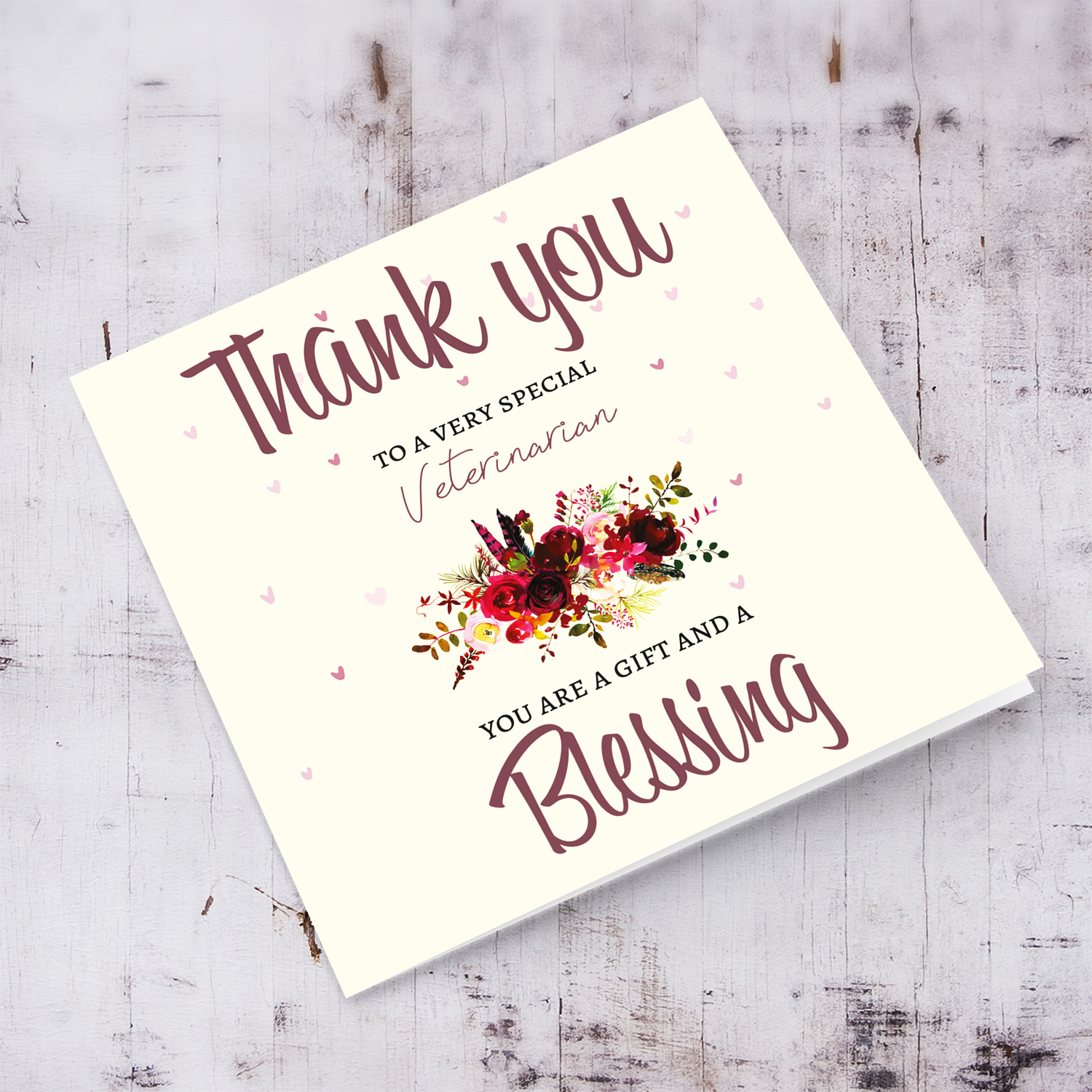 A thank you card to a very special Veterinarian with red florals in English