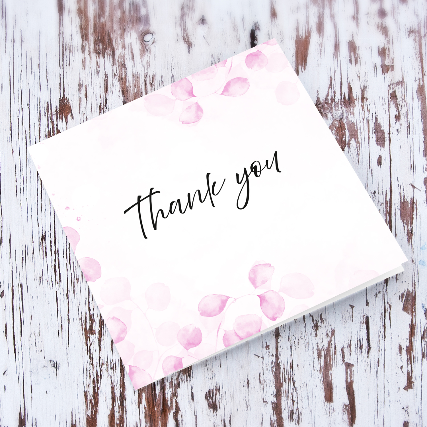A dainty pink leave / plant background thank you card with black text in English (Blank inside)