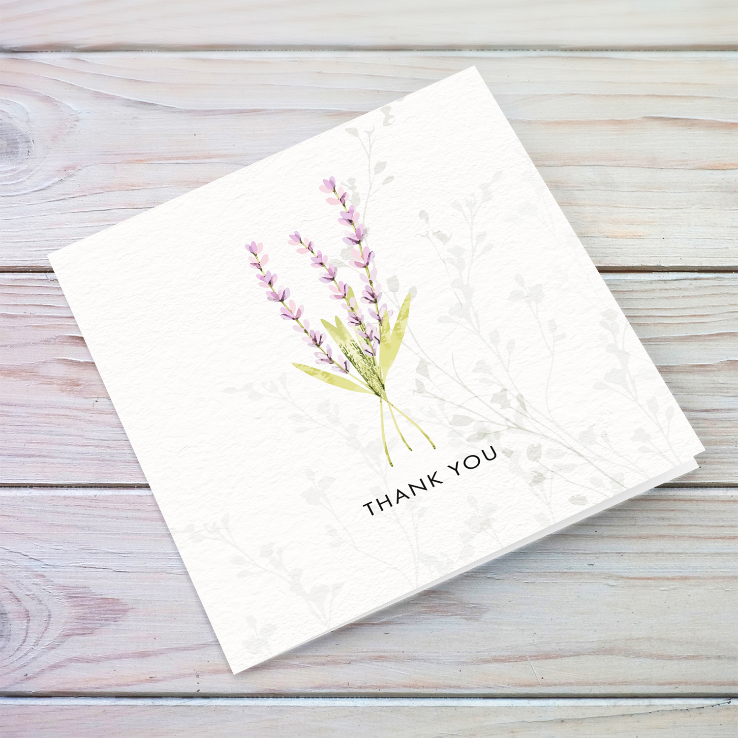 A dainty minimalist thank card featuring a light purple / pink floral detail in English