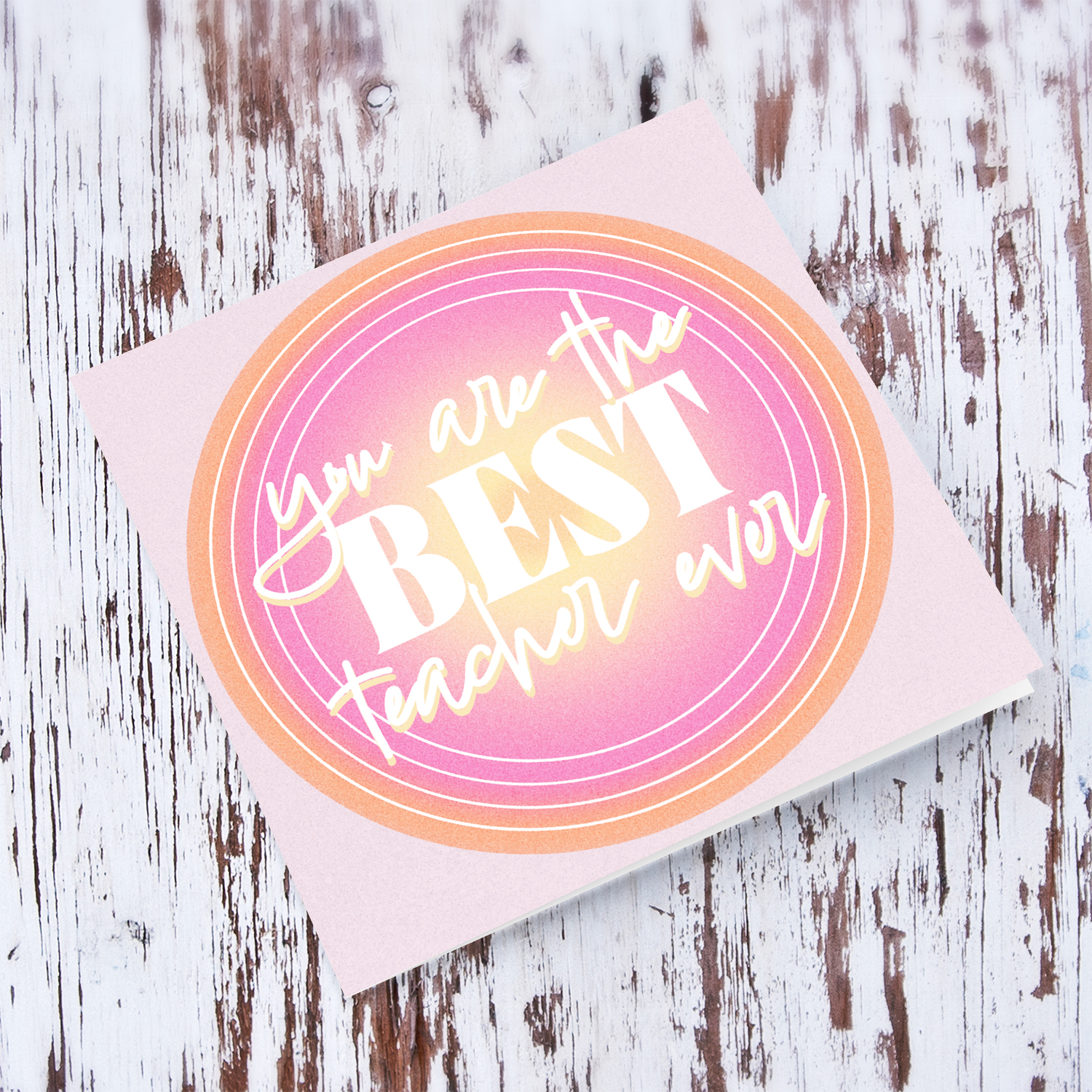BEST TEACHER EVER - thank you card in light pink background featuring a circle with shades of orange and pink in English
